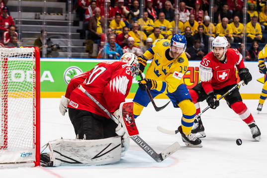 Mattias Ekholm of Sweden against goaltender Reto Berra and