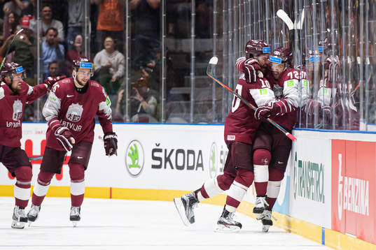 Lauris Darzins and Janis Jaks of Latvia celebrate the 2-3