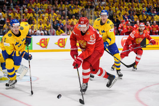 Yevgeni Dadonov of Russia against John Klingberg and Dennis