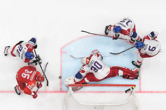 goaltender Simon Hrubec, Filip Hronek and David Musil of