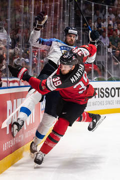 Jani Hakanpää of Finland and Anthony Mantha of Canada