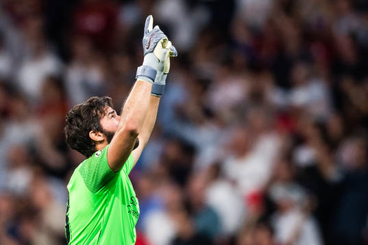 Goalkeeper Alisson Becker of Liverpool celebrates