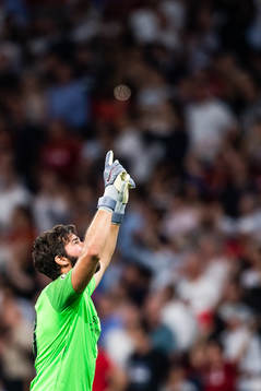Goalkeeper Alisson Becker of Liverpool celebrates