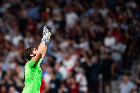 Goalkeeper Alisson Becker of Liverpool celebrates