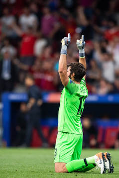 Goalkeeper Alisson Becker of Liverpool celebrates