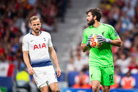Goalkeeper Alisson Becker of Liverpool and Harry Kane of