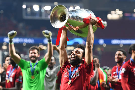 Mohamed Salah of Liverpool celebrates with the throphy