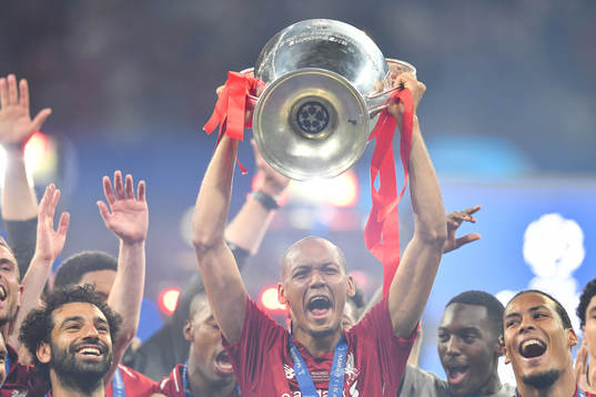 Fabinho of Liverpool celebrate with the trophy