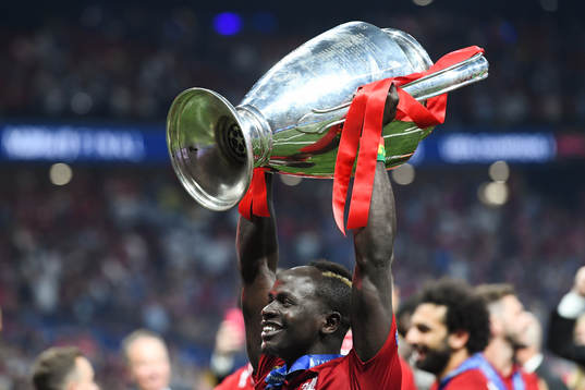 Sadio Mane of Liverpool celebrates with the trophy