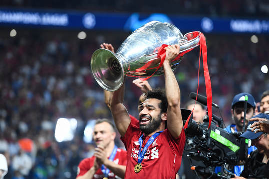 Mohamed Salah of Liverpool celebrates with the trophy