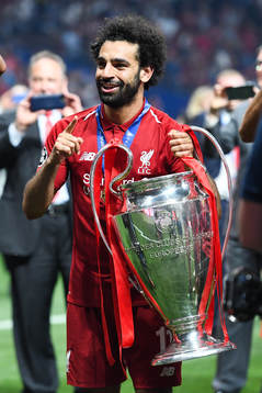 Mohamed Salah of Liverpool celebrates with the trophy