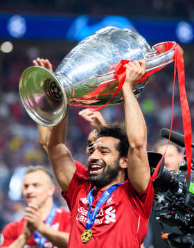 Mohamed Salah of Liverpool celebrates with the throphy