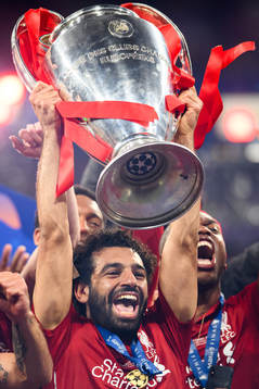 Mohamed Salah of Liverpool celebrate with the trophy