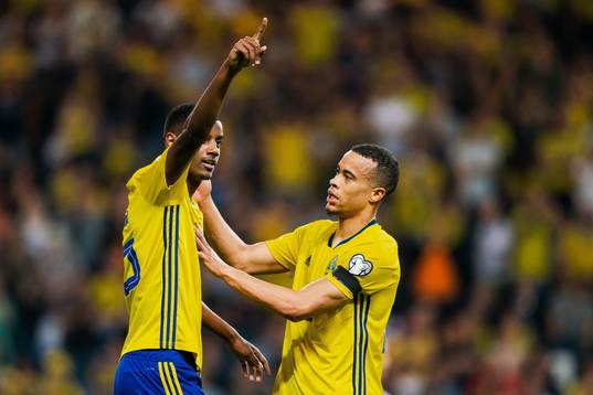 Alexander Isak and Robin Quaison of Sweden celebrate