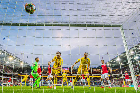 Claudiu Keseru of Romania scores the 2-1 goal