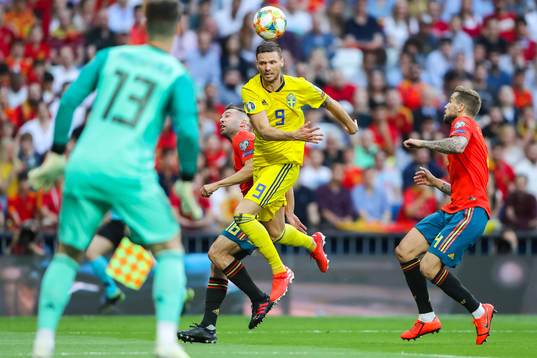 Marcus Berg of Sweden against Jordi Alba and Inigo