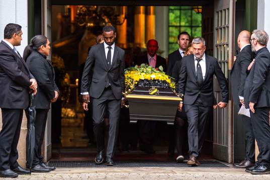 Football player Henok Goitom, Per Karlsson, Matilda Rosqvist, Elsa Törnblom and former football player Nebojša Novaković and Nils Eric Johansson of AIK carries out the coffin
