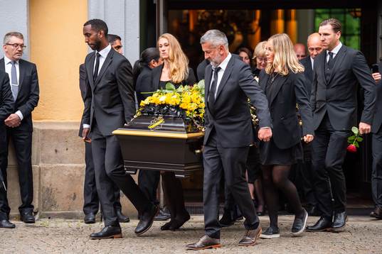 Football player Henok Goitom, Per Karlsson, Matilda Rosqvist, Elsa Törnblom and former football player Nebojša Novaković and Nils Eric Johansson of AIK carries out the coffin