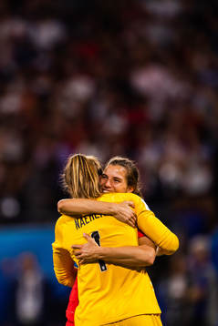 Tobin Heath and goalkeeper Alyssa Naeher of USA celebrate