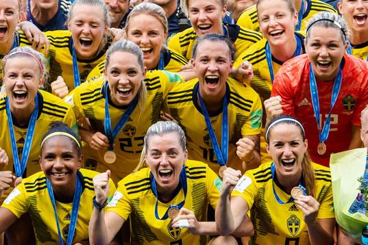 Players of Sweden celebrate with their bronze medals