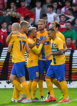 Kasper Larsen,centre, of IFK Norrköping is congratulated