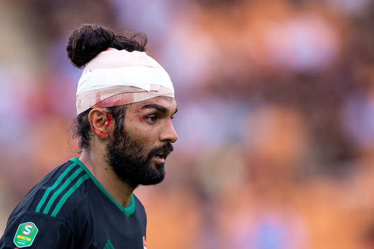 Dalkurds Peshraw Azizi med ett bandage över huvudet