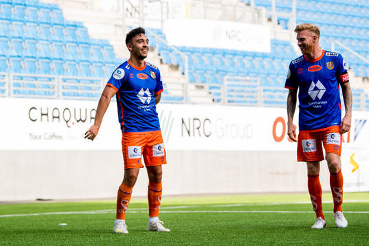 Niklas Castro of Aalesund celebrates with a Fortnite dance in front of teammate Fredrik Carlsen after scoring 0-1