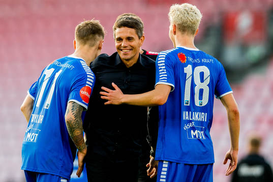Simo Valakari, head coach of Tromsø, celebrates with Robert Taylor and Onni Valakari