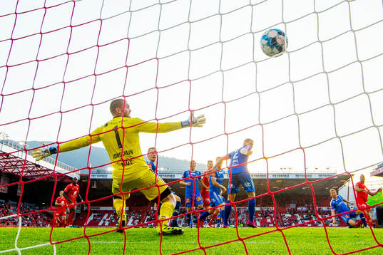 Azar Karadas of Brann scores 2-3 behind goalkeeper Gudmund