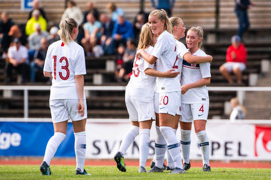 Nora Marie Egenes of Norway and team mates celebrate after the women's