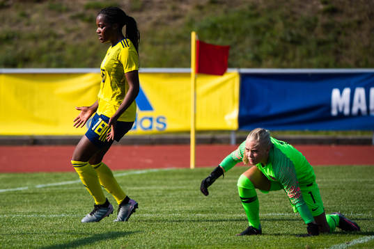 Evelyn Ijeh of Sweden and goalkeeper Hanne Larsen of Norway during the women's