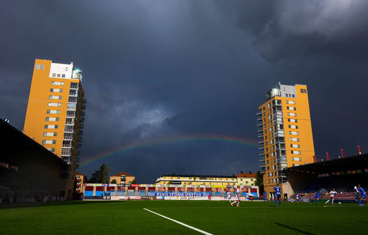 Generell vy över Tunavallen med en regnbåge i bakgrunden