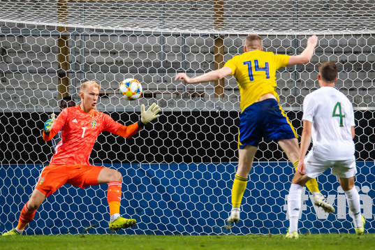 Conor Masterson of Ireland scores 1-1 behind goalkeeper Pontus Dahlberg  of Sweden that was later disallowed