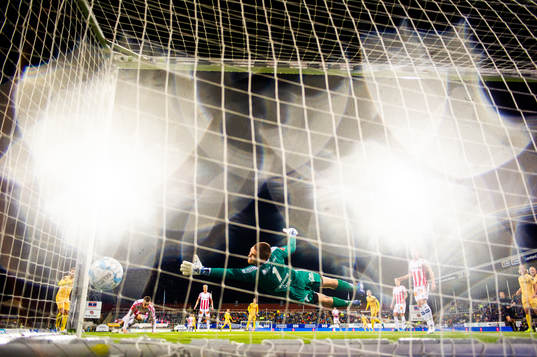 Philip Zinckernagel of Bodø/Glimt scores the 4-0 goal behind goalkeeper Gudmund Kongshavn of Tromsø