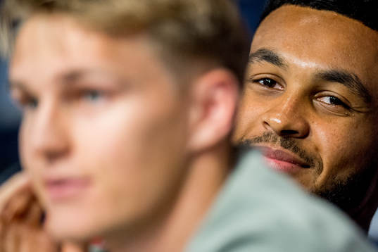 Joshua King of Norway listens to Martin Ødegaard