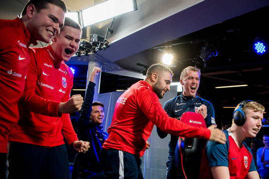Andreas Bakken, Anders Rasmussen, Mats Theie Bretvik, team manager of Norway, Arkan Resul, Marius Hjerpseth, coach of Norway, and Magnus Myhrhaug Kristiansen celebrate