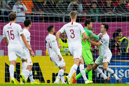 Goalkeeper Rune Almenning Jarstein of Norway celebrates with Ole Kristian Selnæs after saving a penalty