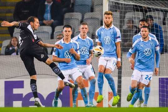 Alexander Gerndt of Lugano with a shoot against Jonas Knudsen, Sören Rieks, Rasmus Bengtsson and Lasse Nielsen of Malmö FF