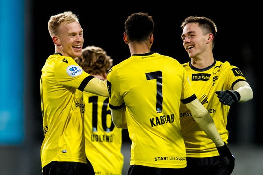 Martin Ramsland of Start celebrates with teammates Kevin Kabran and Espen Hammer Berger after scoring 0-2