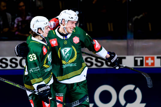 Albert Johansson and Victor Ejdsell of Färjestad celebrate