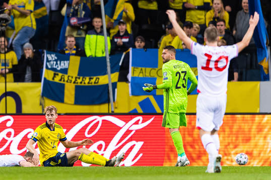 Gilli Rólantsson of Faroe Islands with Filip Helander and
