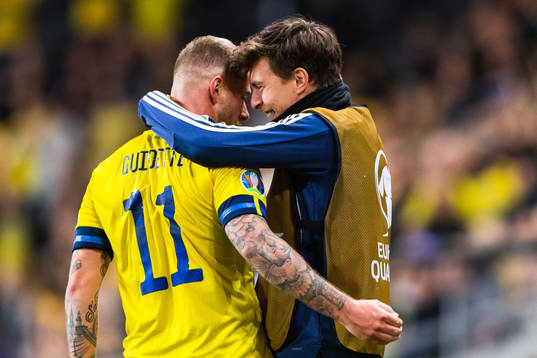 John Guidetti of Sweden celebrates scoring 3-0 and hugs Victor Nilsson Lindelöf