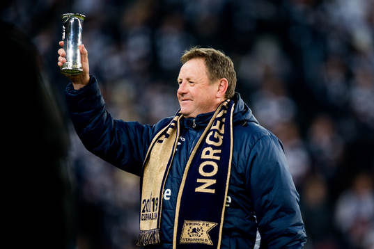 Bjarne Berntsen, head coach of Viking, celebrates with the trophy