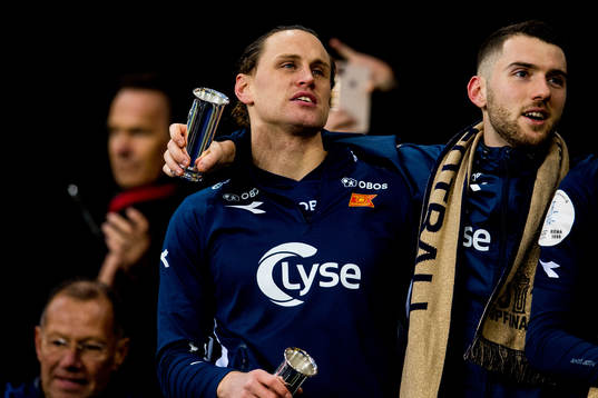 Tommy Høiland and Zymer Bytyqi of Viking celebrate