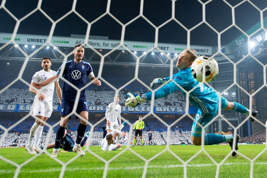 Markus Rosenberg of Malmö FF look at the ball shot by Arnor Traustason (not pictured) as it pass goalkeeper Karl-Johan Johnsson of FC Köpenhamn to 0-1