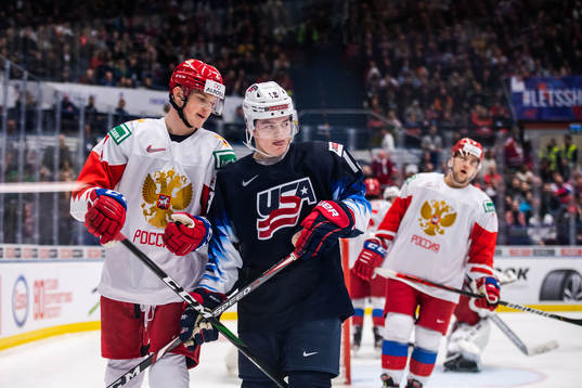 Danil Zhuravlyov of Russia and Cole Caufield of USA