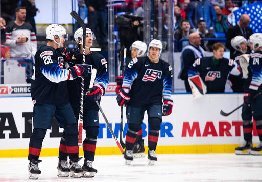 Arthur Kaliyev and Trevor Zegras of USA celebrate the 0-3