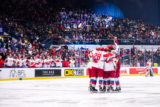 Alexander Romanov of Russia celebrate with teammates