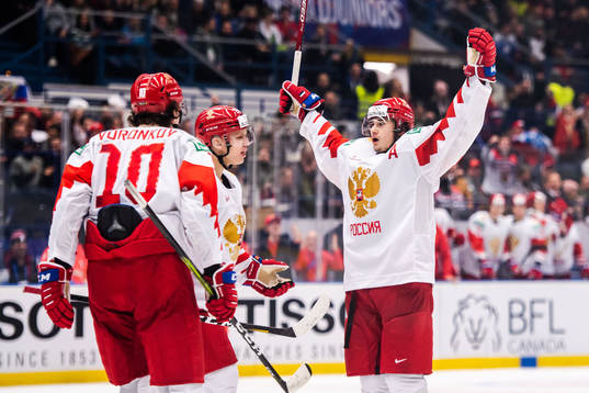 Alexander Romanov of Russia celebrate with teammates