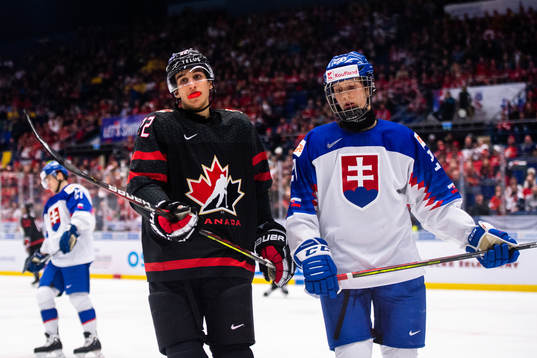 Dylan Cozens of Canada and Samuel Knazko of Slovakia